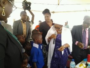  Mrs. Uzamat, representative of the First Lady of Lagos State, Mrs. Bolanle Ambode, de-worming a pupil at the launch of the Mass De-worming campaign in Lagos state Pix: Rebecca Ejiofor 