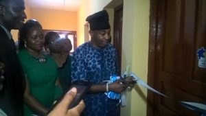 Hon. Olayinka Kazeem cutting the tape during the commissioning