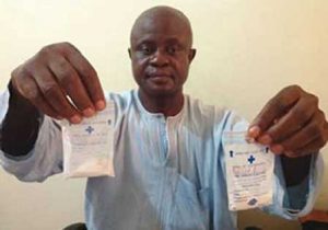 Prof. Ezeibe displaying samples of his drug